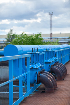 Many blue pipelines with stop-gate valves at industrial plant