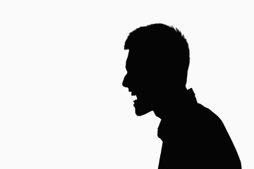 Silhouette of man screaming.