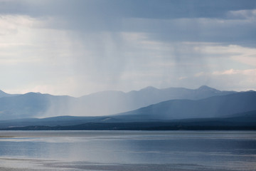 Rain shower over Marsh Lake Yukon Territory Canda