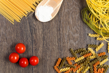 pasta, tomatoes and flour on the spoon