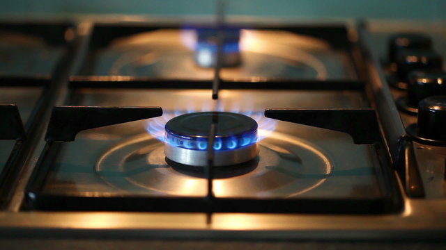 Gas hob with two rings burning, then turned off.