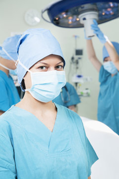 Portrait of female surgeon wearing surgical mask in the operating room, 