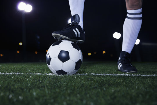 Close Up Of Feet On Top Of Soccer Ball On The Line, Night Time In The Stadium