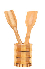 Wooden kitchen utensils in a jar.
