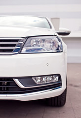 Closeup photo of a white car's headlight