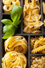 various pasta in black wooden box