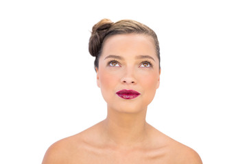 Attractive woman with red lips looking up