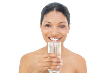 Cheerful black haired model holding glass of water