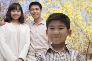 Portrait of happy smiling family in the park in springtime, Beijing, China