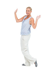 Woman looking at camera with hands raised