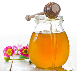 Glass jar of honey