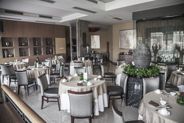 Dining room with elegant table settings.