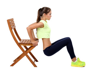 Beautiful young girl doing exercises isolated on white