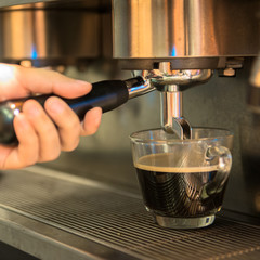 Espresso machine brewing a coffee espresso