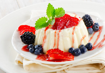 Dessert with fresh berries .