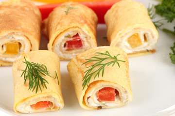Egg rolls with cheese cream and paprika,on plate, close up