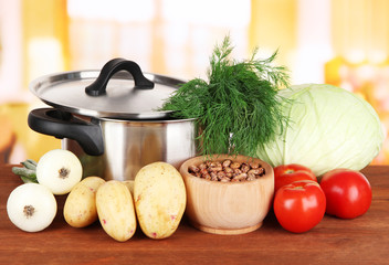 Ingredients for cooking borsch on table in kitchen