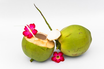 Green coconuts over white background