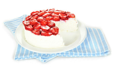 Cheesecake with fresh berries on white plate closeup