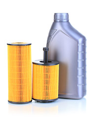 Car oil filters and motor oil can isolated on white