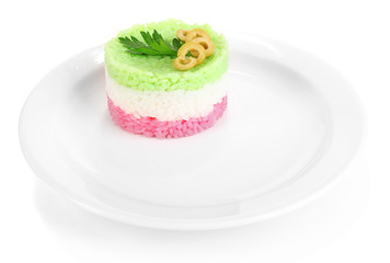 Colored rice on plate isolated on white