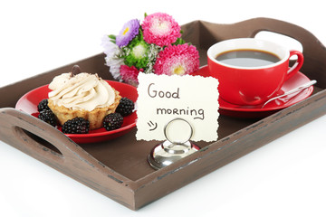 Cup of tea with cakes on wooden tray isolated on white