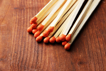 Long matches for fireplace, on wooden background