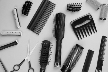 Professional hairdresser tools on gray background
