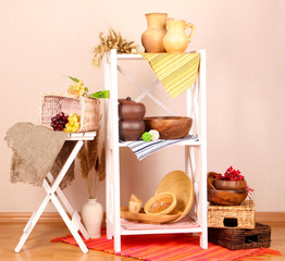 Beautiful white shelves with tableware and decor,