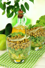Tasty salad with fresh vegetables on wooden table