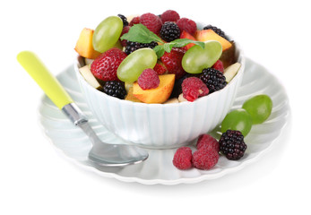 Fruit salad in bowl, isolated on white