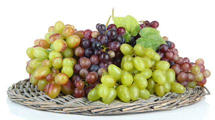 Fresh grape on wicker mat isolated on white