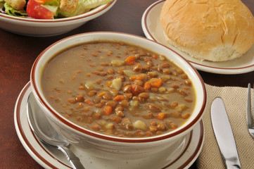 Lentil soup with salad and a roll