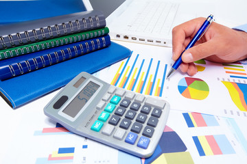 Obraz premium Hand with calculator.