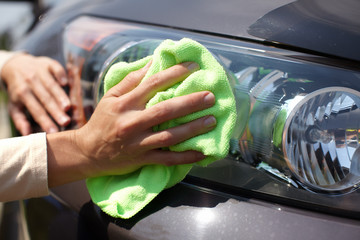 Hand polishing car.