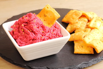 Beetroot and chickpea hummus dip with crackers