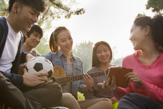 Teenagers hanging out in the park 