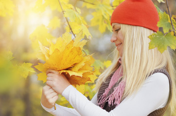 Girl with a bouquet of leaves