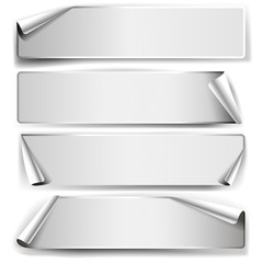 Set of black and white sticky notes with rolled edges.