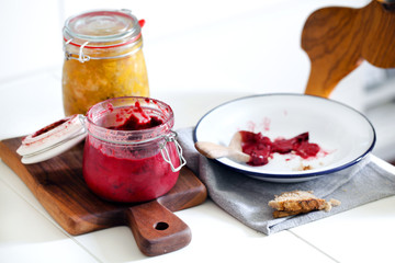 Plum and peach jam or preservative in jar, rustic breakfast