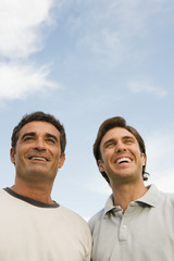 Two men smiling