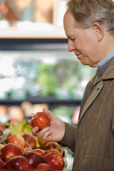 A man holding an apple