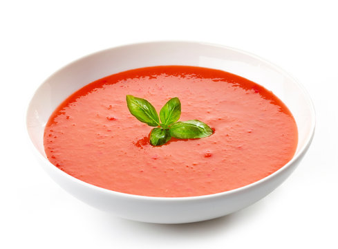 bowl of tomato soup with basil