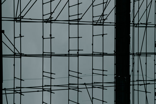 Close up of scaffolding on a construction site with blue backgro