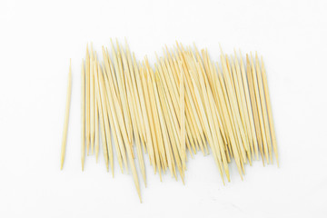 Many toothpicks on a white background