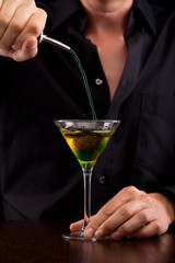 Bartender pours drink