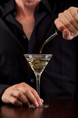 Bartender pours drink