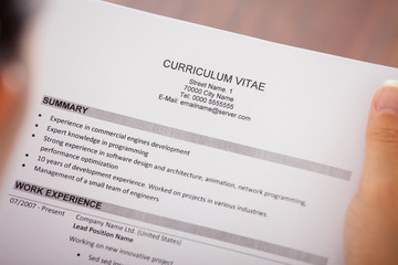 Young Businesswoman Reading Curriculum Vitae