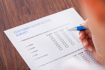 Hand With Pen Over Blank Form