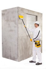 Worker cleaning the surface with a broomstick